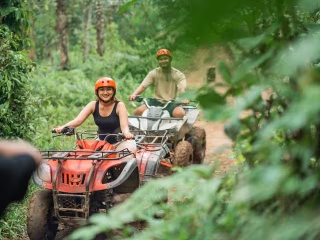 ATV quad off-road volcano trail ride through mud and rivers in La Fortuna