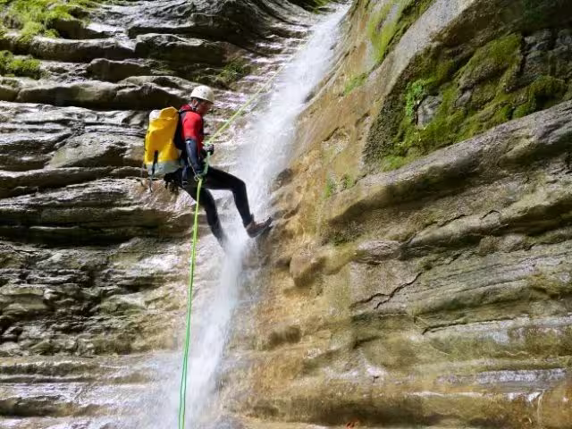 Canyoning waterfall rappelling adventure in La Fortuna forest canyon